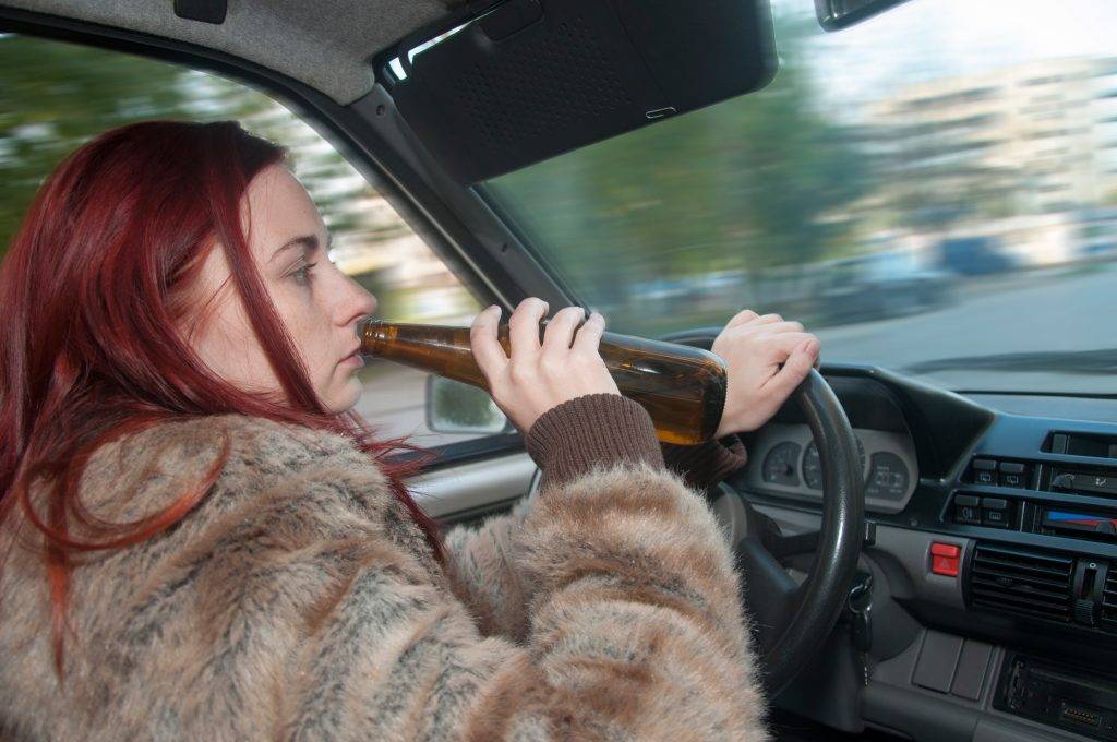 Drunk-Woman-Driving-Car-With-B