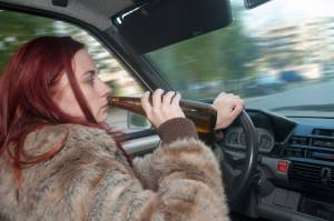Drunk-Woman-Driving-Car-With-B